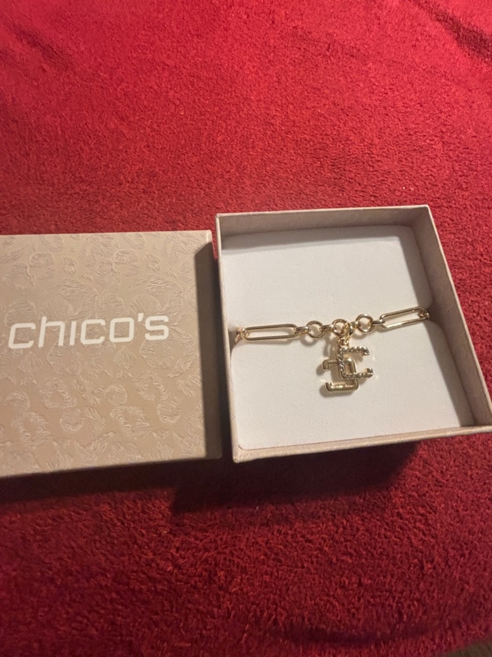 Chico's Shiny Gold Tone and Link Bracelet with Logo Rhinestone Charm. New